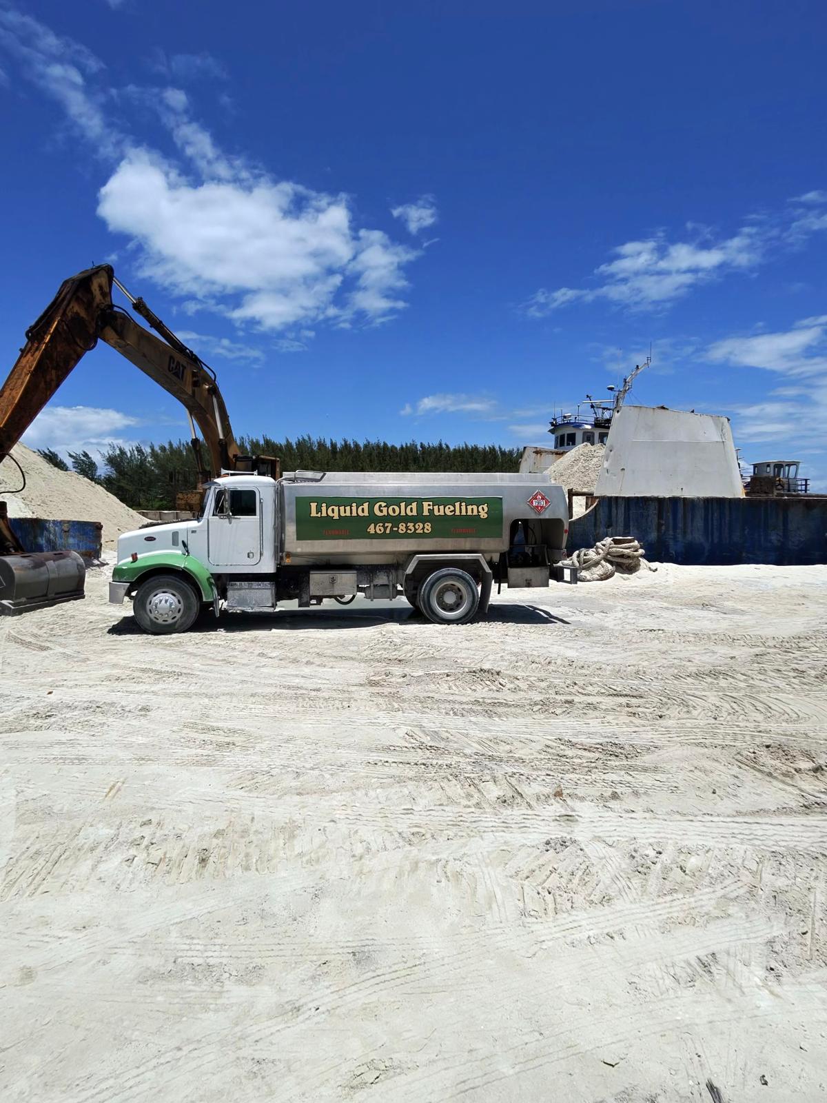 Liquid Gold Fueling delivery tank truck on site in Nassau